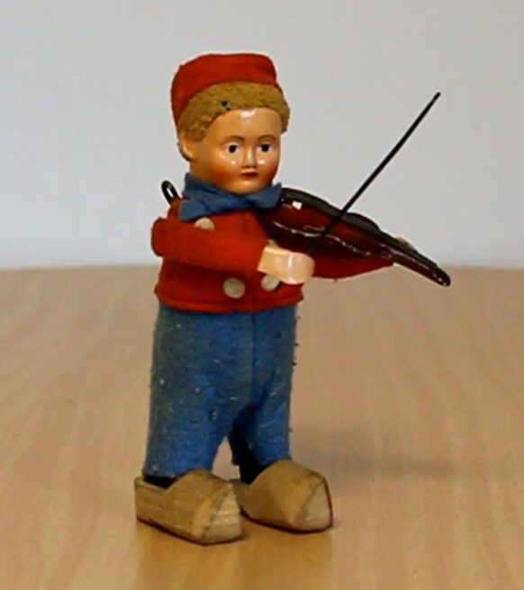 Blechspielzeug (Ein Geige spielende Figur))